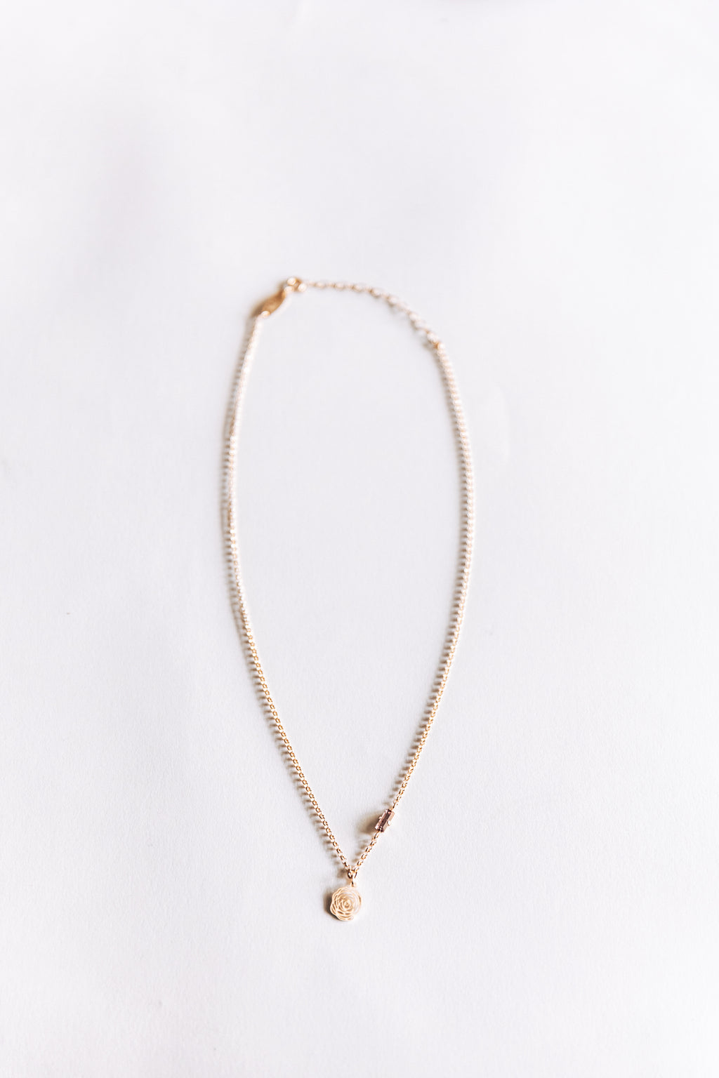 Rose Gold necklace on a white background